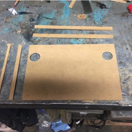 Battery top made from scrap wood